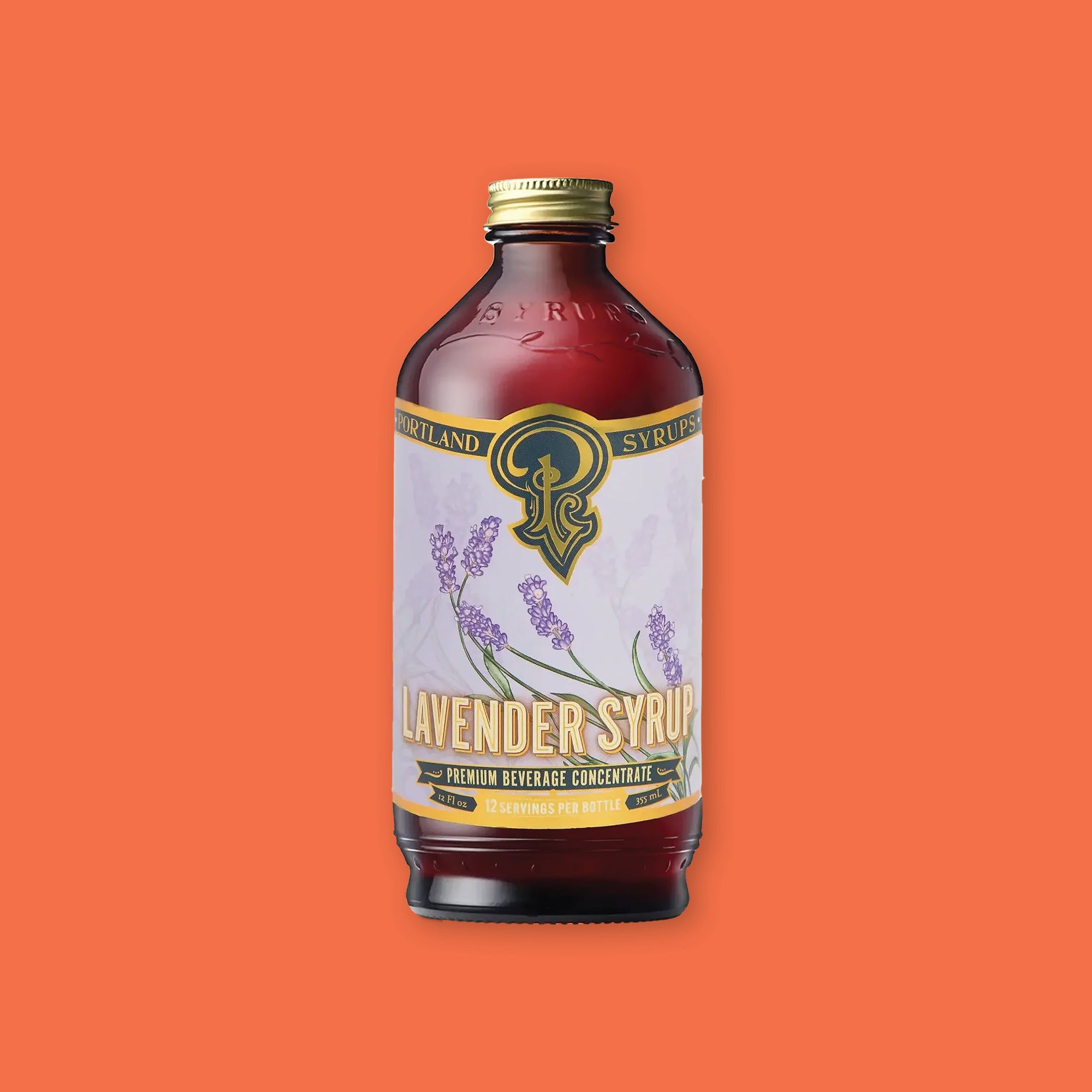 On an orangey-red background sits a bottle. This brown bottle has a gold top and colorful label. It says in gold "PORTLAND SYRUPS" in all caps serif font. It has an illustration of lavender on a light purple background and it says "LAVENDER SYRUP" in white and gold, all caps block font. It also says "PREMIUM BEVERAGE CONCENTRATE" in gold, all caps block font. 12 servings per bottle. 12 Fl oz 355 mL