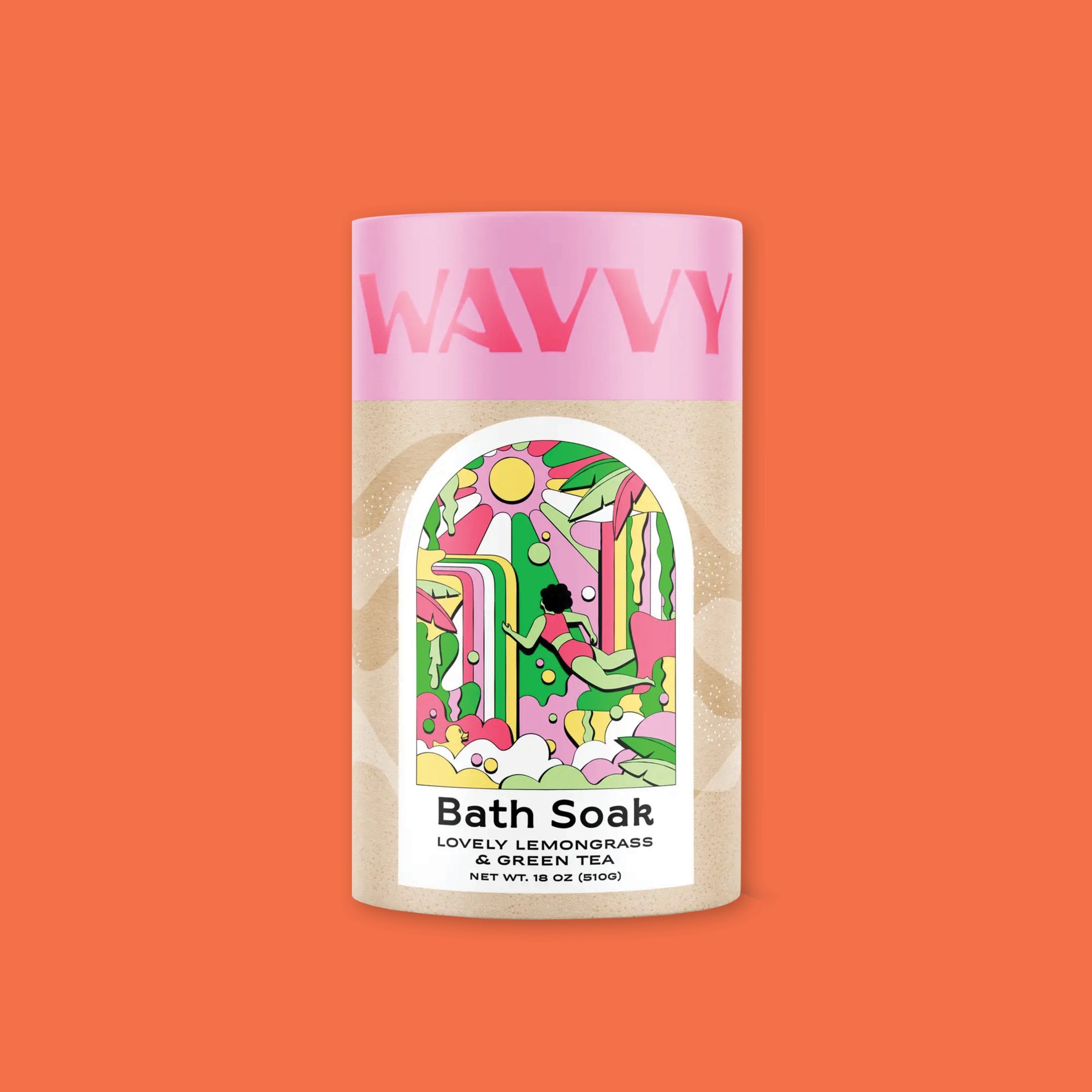 On an orangey-red background sits a container. This ccontainer has a pink lid that says "WAVVY" in hot pink, all caps font. The bottom part is a kraft color with a colorful label has an illustration of a sun, waterfall, banana tree leaves, bubbles, a woman swimming, and a rubber duckie in colors of pink, kelly green, yellow, hot pink, and white. It says on the bottom "Bath Soak" in black, block font. It also says "LOVELY LEMONGRASS & GREEN TEA" in black, all caps block font. NET WT. 18 OZ (510G)