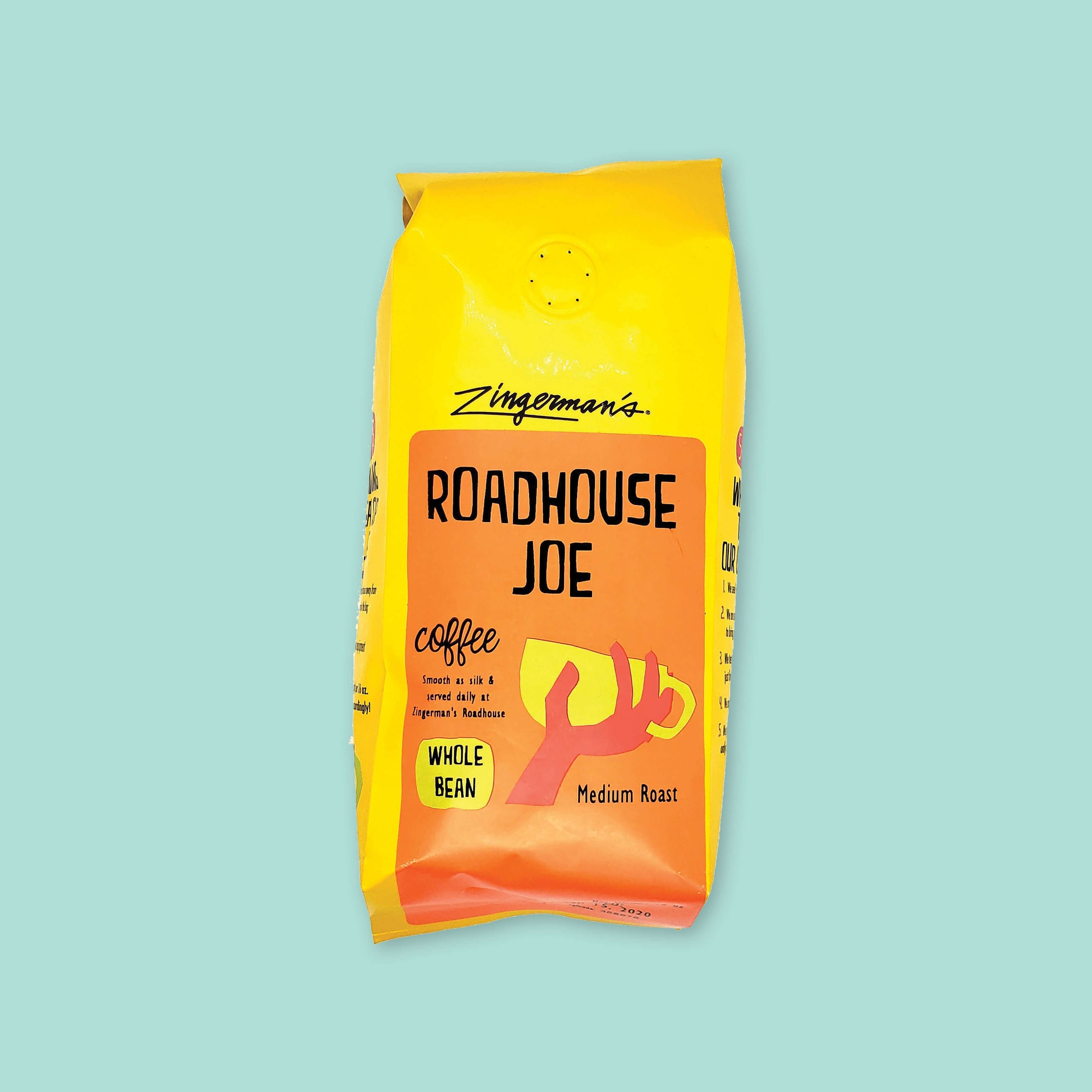 On a cool aqua background is a yellow bag of coffee. The coffee is Zingerman's brand Roadhouse Joe Blend. 'Smooth as silk and served daily at Zingerman's Roadhouse' Ground coffee. 12 oz (350 g)