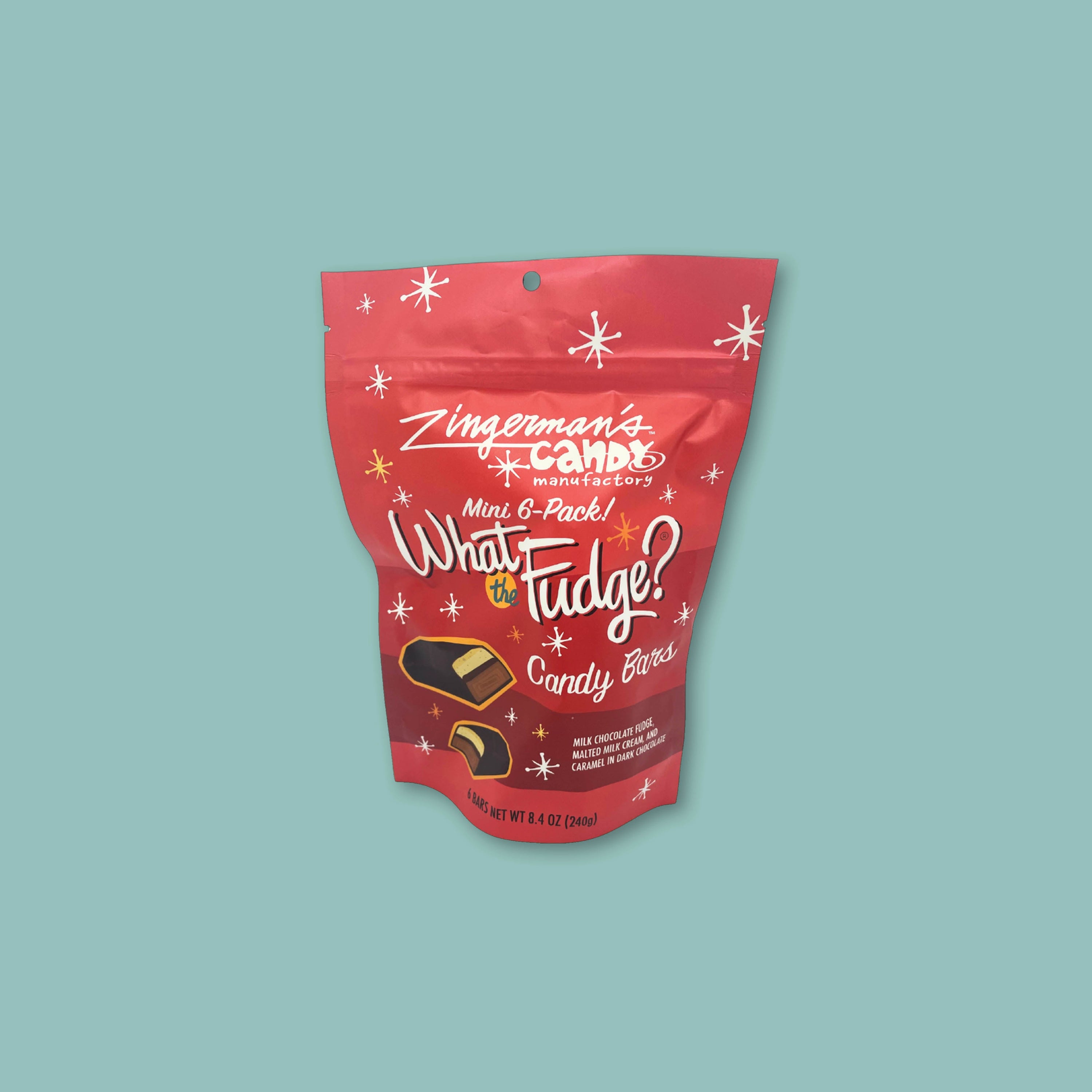 On a teal background sits a red bag of Zingerman's What the Fudge candy bars.