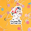 On a sunny mustard background sits a sticker with colorful confetti and white crinkle scattered around. This vintage sticker has an illustration of a cute white lamb holding a red tulip and a garland of flowers on it's head tied with a red ribbon around it's neck. It says "I'm pretty cool but I cry a lot" in black, handdwritten lettering. Approximately 3".