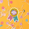 On a sunny mustard background sits a sticker with white crinkle and big, colorful confetti scattered around. This colorful ribbon sticker has an illustration of an open book and a rainbow meter above it. It says "BOOK IT!" in a white, bubble text. There are handdrawn doodles on the pink and turquoise ribbons. 'ALL-TIME WINNINGEST PIZZA PARTY CHAMPION'.