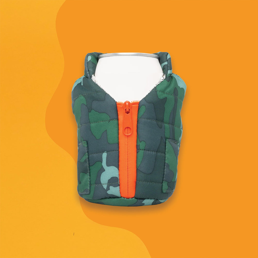 On a sunny mustard and orange mustard retro background sits a koozie. The picture is a vest koozie that has green camoflauge and an orange zipper on the front. There is a white can sitting in the koozie.