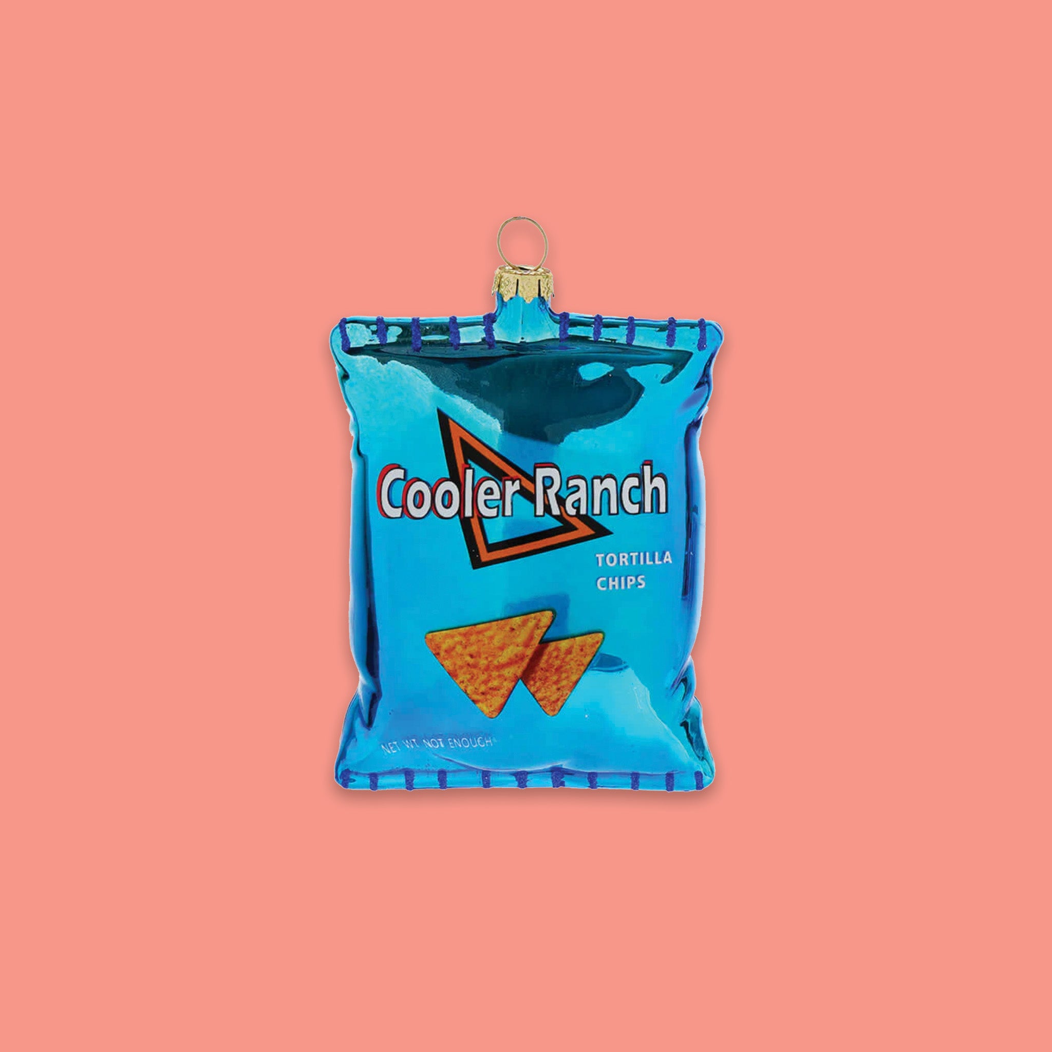 On a coral pink background sits a chip bag ornament. This turquoise glass 'Cooler Ranch Tortilla Chips' ornament looks like a real bag of chips and has tortilla chips on the front. It says on the bottom "NET WT NOT ENOUGH." 