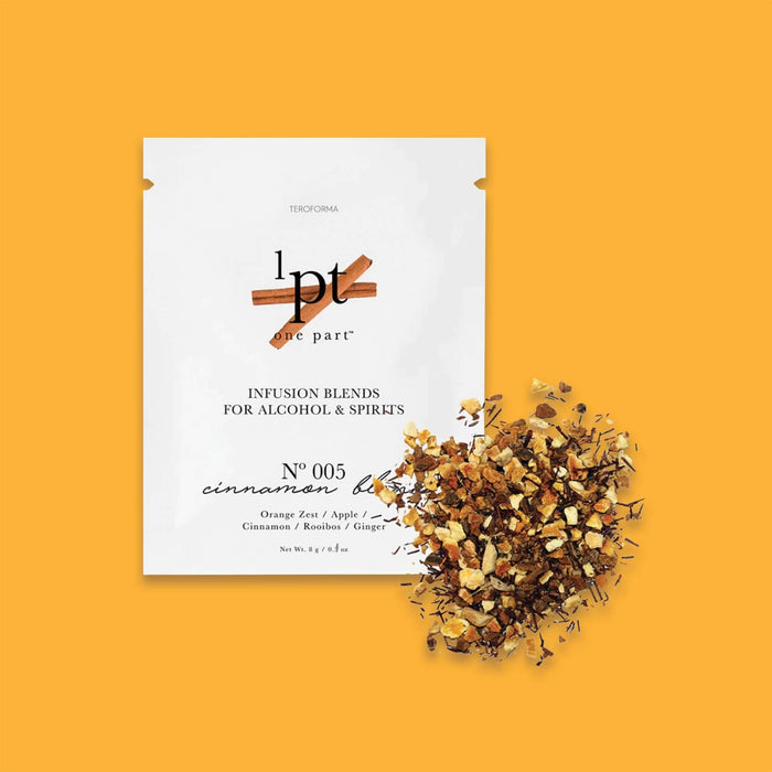 On a sunny mustard background sits a white packet. This One Part Co. single use packet has a picture of cinnamon sticks. It says "INFUSION BLENDS FOR ALCOHOL & SPIRITS" in black, all caps serif font. It is a No 005 'cinnamon blend' with flavors of 'Orange Zest / Apple / Cinnamon / Rooibos / Ginger'. It has seasoning contents of the packet scattered on the right side. Net Wt. 8g / 9.3oz