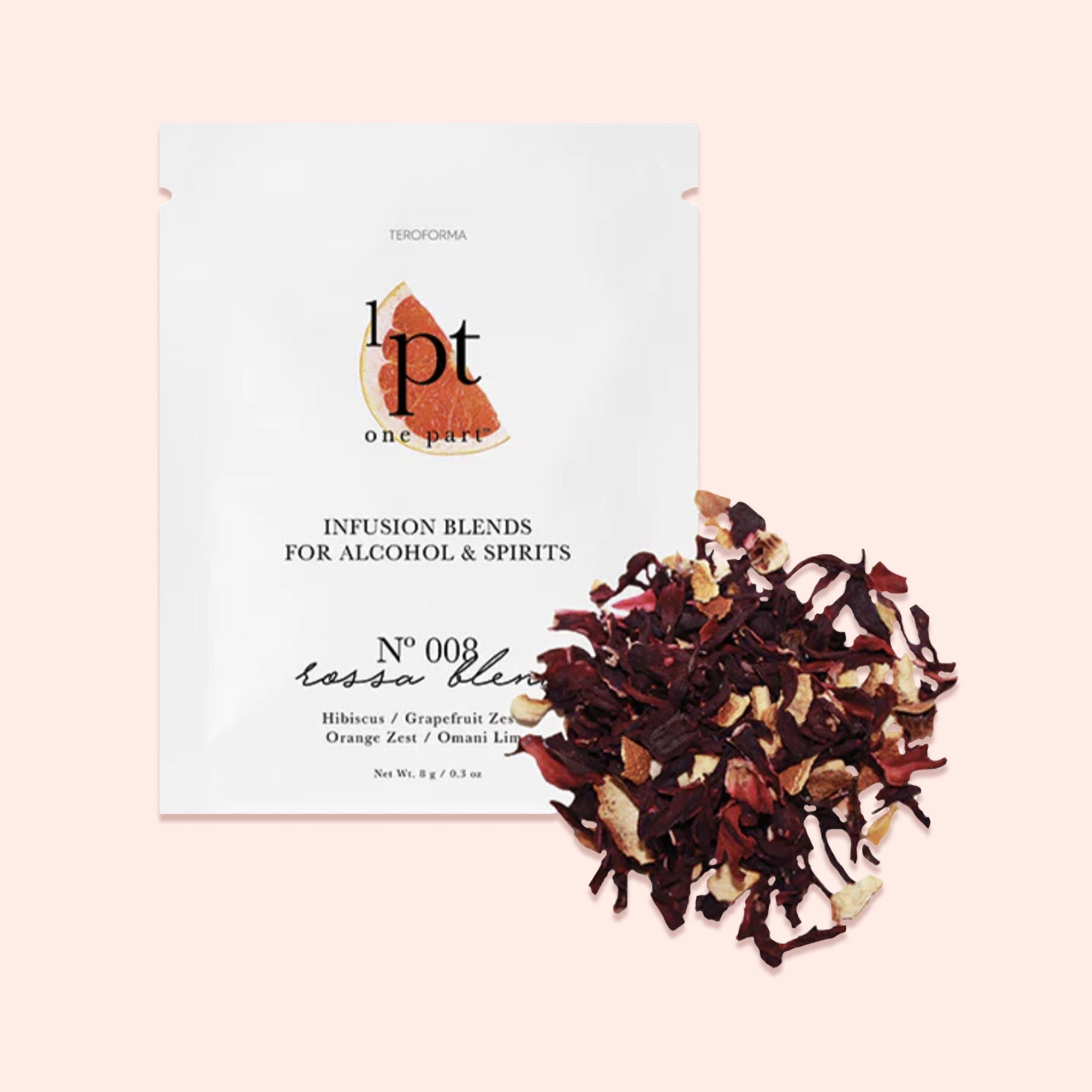 On a light pink background sits a white packet. This One Part Co. single use packet has a picture of chocolate shavings. It says "INFUSION BLENDS FOR ALCOHOL & SPIRITS" in black, all caps serif font. It is a No 008 'rossa blend' with flavors of 'Hibiscus / Grapefruit Zest / Orange Zest / Omani Lime'. It has seasoning contents of the packet scattered on the right side. Net Wt. 8g / 9.3oz