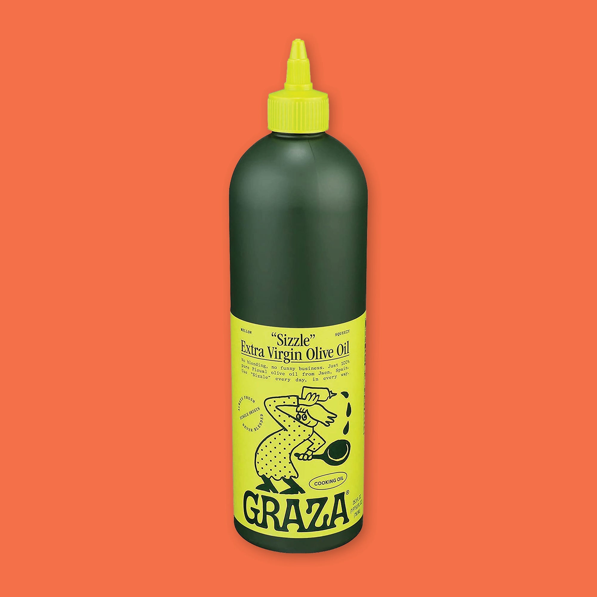 On an orangey-red background sits a bottle. This dark green bottle has a yellow cap and label. It says ""Sizzle" Extra Virgin Olive Oil" in black, serif font. It is "MELLOW" AND "SQUEEZY". It has an illustration of an olive branch with a spout on the olive in black. It says "ALWAYS FRESH NEVER BLENDED SINGLE ORIGIN" and "COOKING OIL" and "GRAZA" at the bottom in black, handwritten lettering. 25.3 fl oz (750 ml)