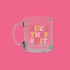 On a hot pink background sits a mug. This clear mug says "FUCK THIS SHIT" in a colorful, thick serif font. The colors are watermelon pink, sunny mustard and light pink.