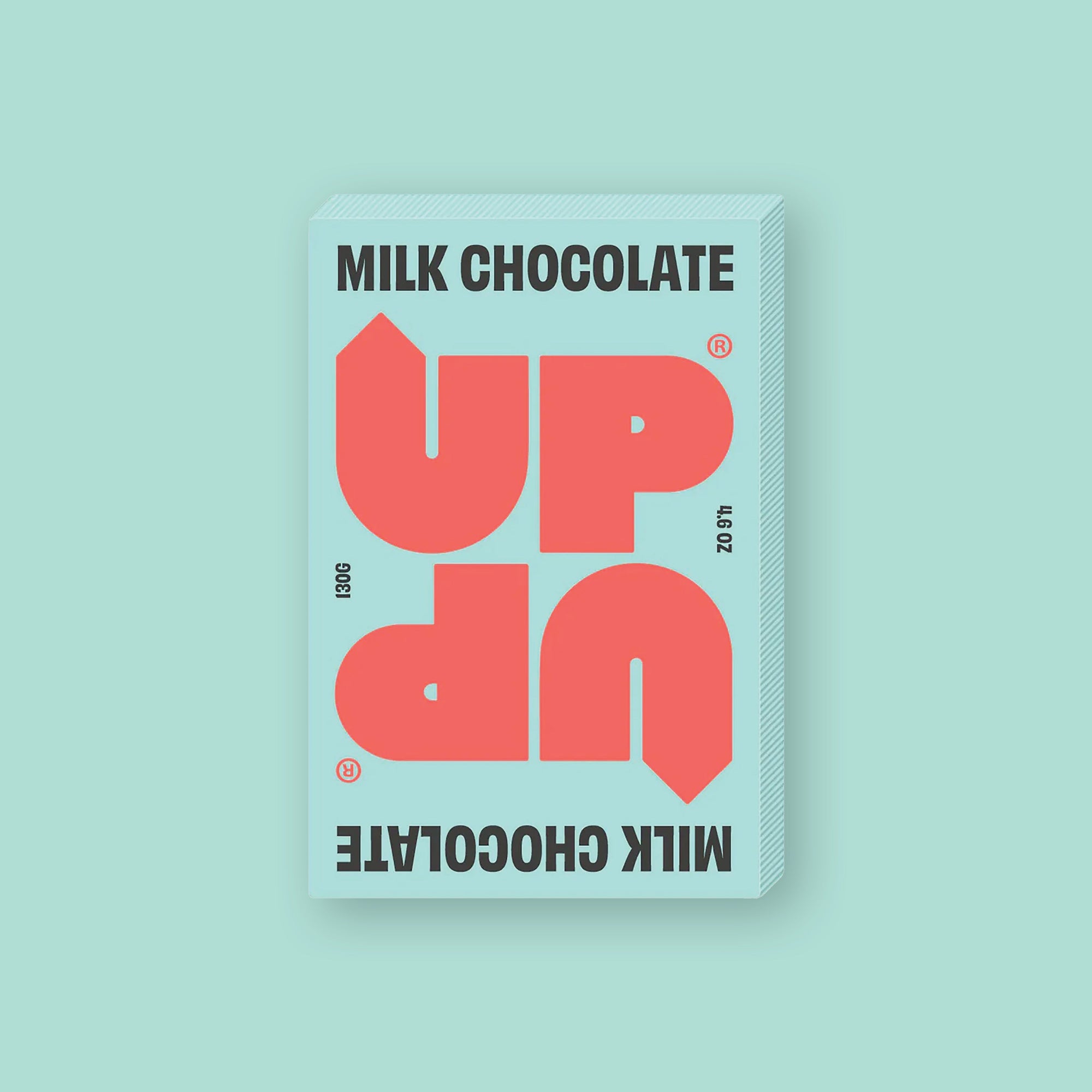 On a mint green background sits a box of UP UP Milk Chocolate. The packaging is in mint green and orangey-red. 130G 4.6 OZ
