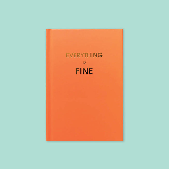 On a mint background sits a book. This orange journal says "EVERYTHING IS FINE" in gold, all caps block font.
