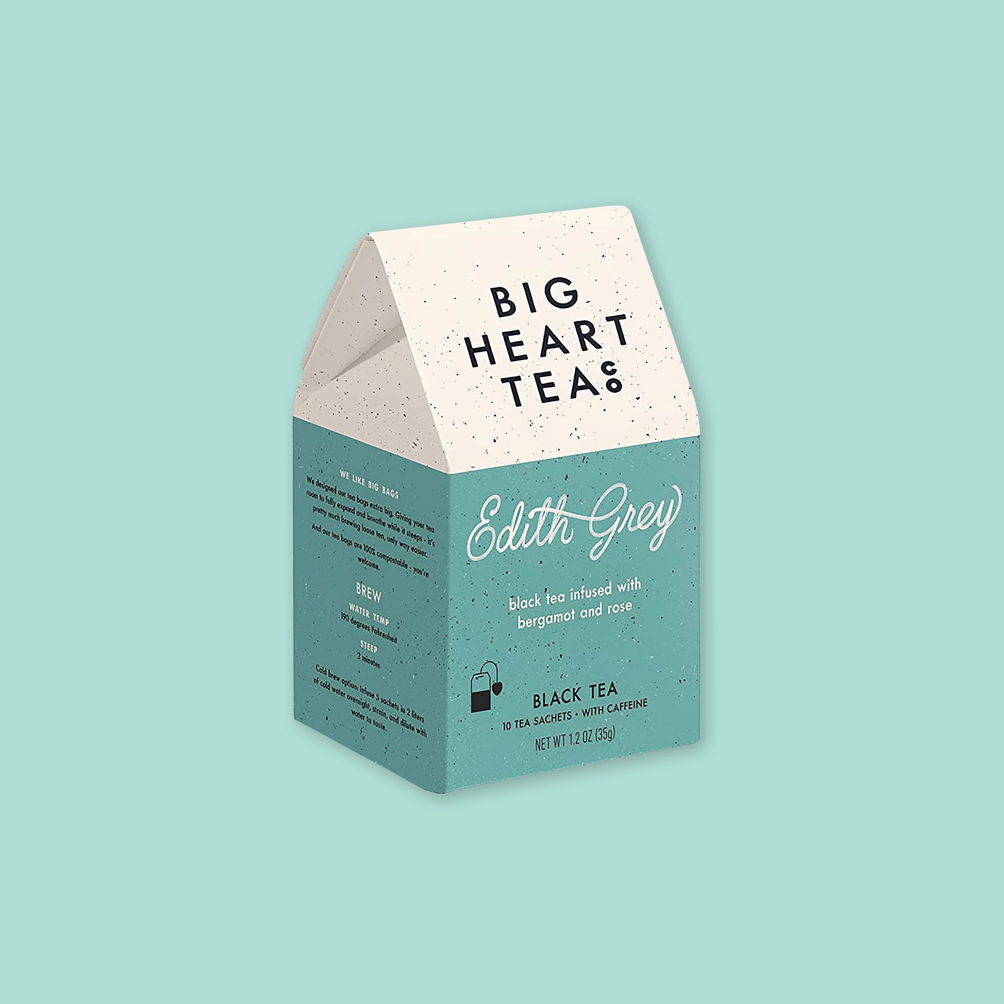 On a mint green background sits a tented carton. The tented part is white and the bottom part is a dark mint. It has black flecks all over it. It is 'BIG HEART TEA' and says "Edith Grey" in white, handwritten scipt lettering. Under that it says in white "black tea infused with bergamot and rose" in lower case block font. It has an black illustration of a tea bag. 'BLACK TEA' 10 tea sachets • with caffeine, net wt 1.2 oz (35g)