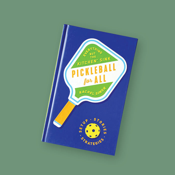 On a moss green background sits a book. This bright blue book has a colorful illustration of a pickleball paddle and a yellow ball. Inside the paddle it says "EVERYTHING BUT THE 'KITCHEN' SINK," "RACHEL SIMON" in yellow, all caps block font. It also says "PICKLEBALL for ALL" in orange, block and script font. Around the ball it says "SETUP • STORIES • STRATEGIES" in orange, all caps block font.
