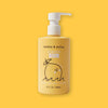 On a sunny mustard background sits a yellow bottle with a white pump cap. It has a black illustrated lemon on the front and it says "dabble & dollop" in black, block font. It is a 'LEMON GEL' and it is 'tear free!'. I also says "BUBBLES • BODY WASH • SHAMPOO" in white, all caps block font. 10 FL. OZ. / 296mL