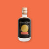 On an orangey-red background sits a clear bottle with a natural top. It has a dark liquid in it. It has a yellow circle and a dark coral rectangle on it. It says in white "BRIGHTLAND," "RAPTURE BALSAMIC VINEGAR," and "WITH CALIFORNIA BLACKBERRIES" in white, all caps block font. 100 ML 3.4 OZ
