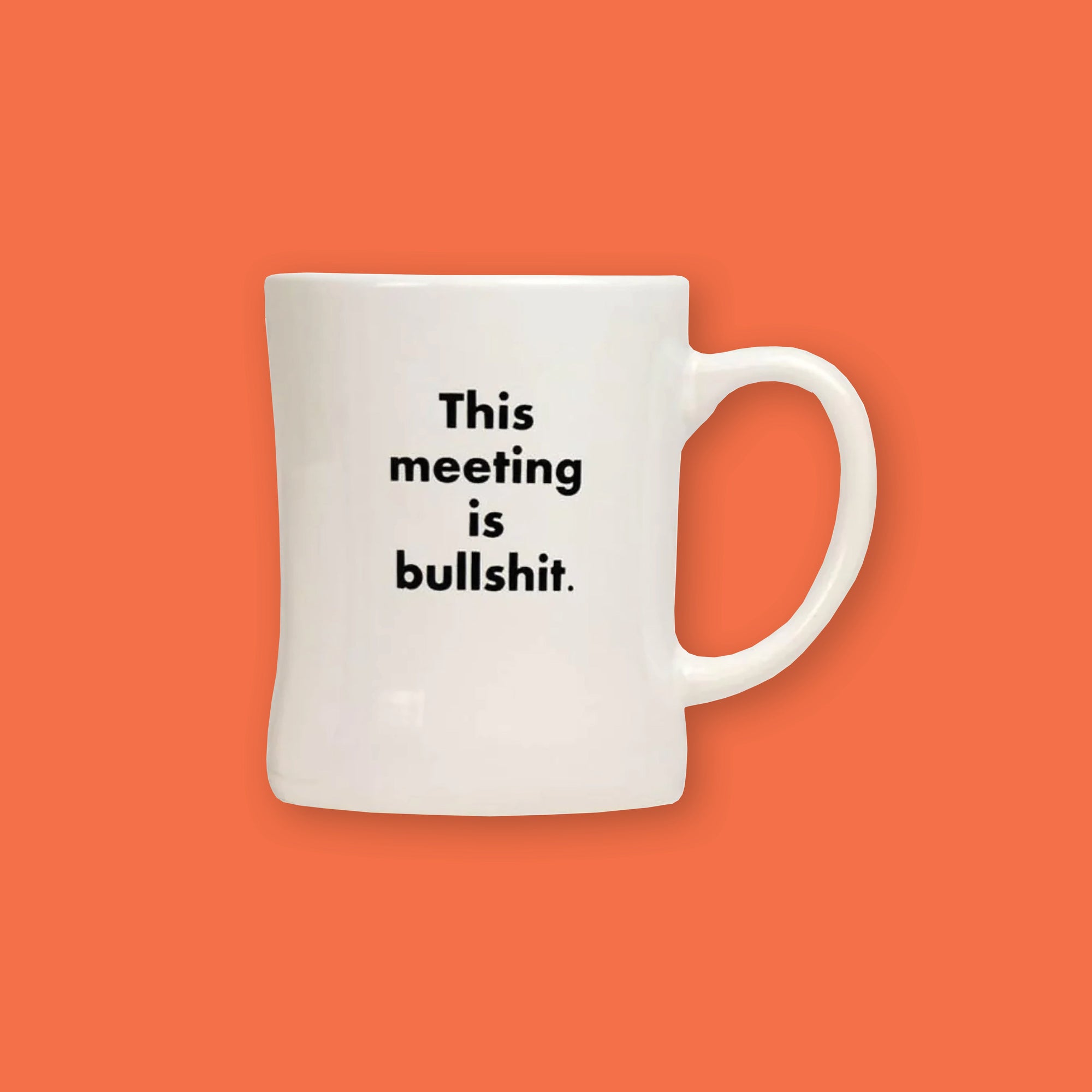 On an orangey-red background sits a mug. This white, diner style mug says "This meeting is bullshit." in black, block font.