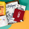 On a bright kelly green background with sunny yellow and orange wobbly cutouts sits a wooden tray with an assortment of Michigan and Ann Arbor themed gifts. This photo is a close-up of the "It's Called Pop Not Soda" red koozie and white illustrated map of Michigan tea towel.