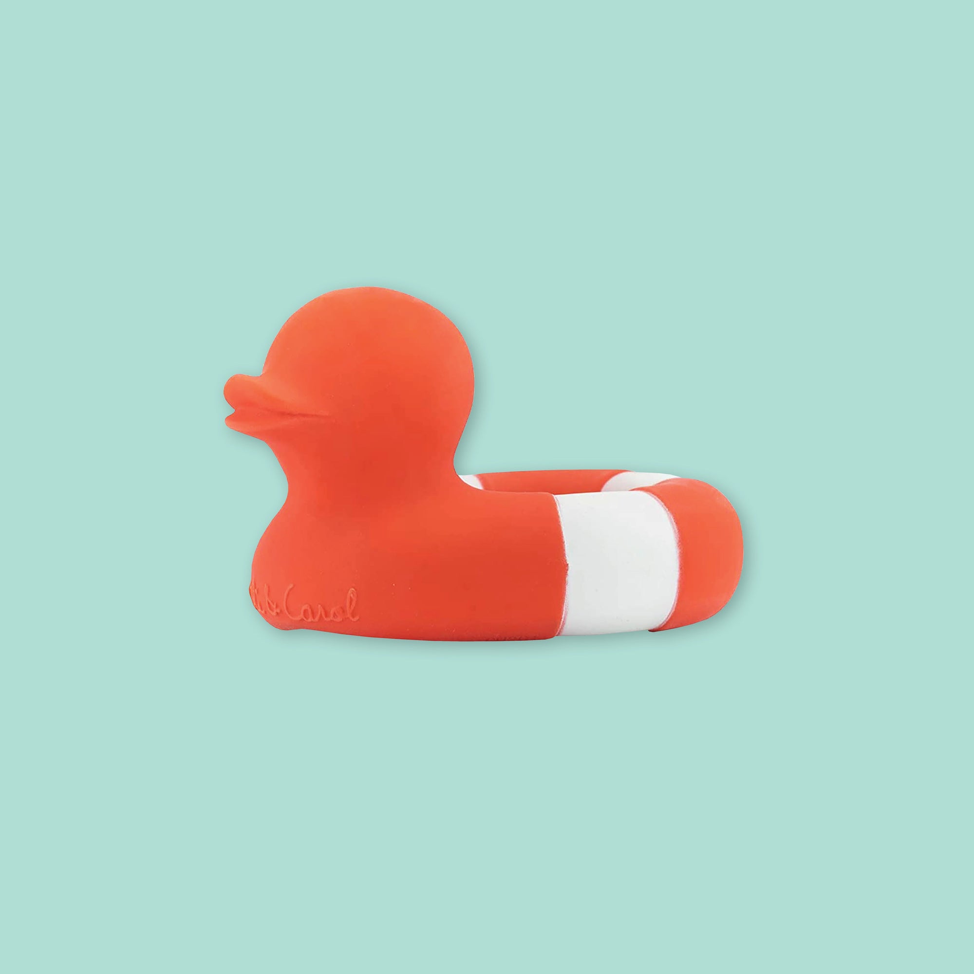 On a mint green background sits an orangey-red and white rubber duckie.