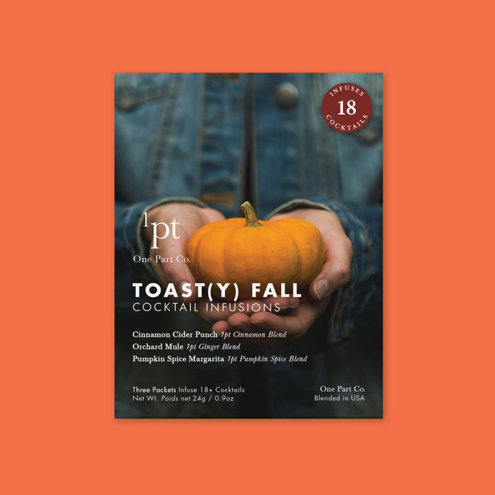 A packet of Toasty Fall Cocktail Infusions sits on an orange background. The packaging features details of the mixers and a photo of hands holding a small pumpkin.