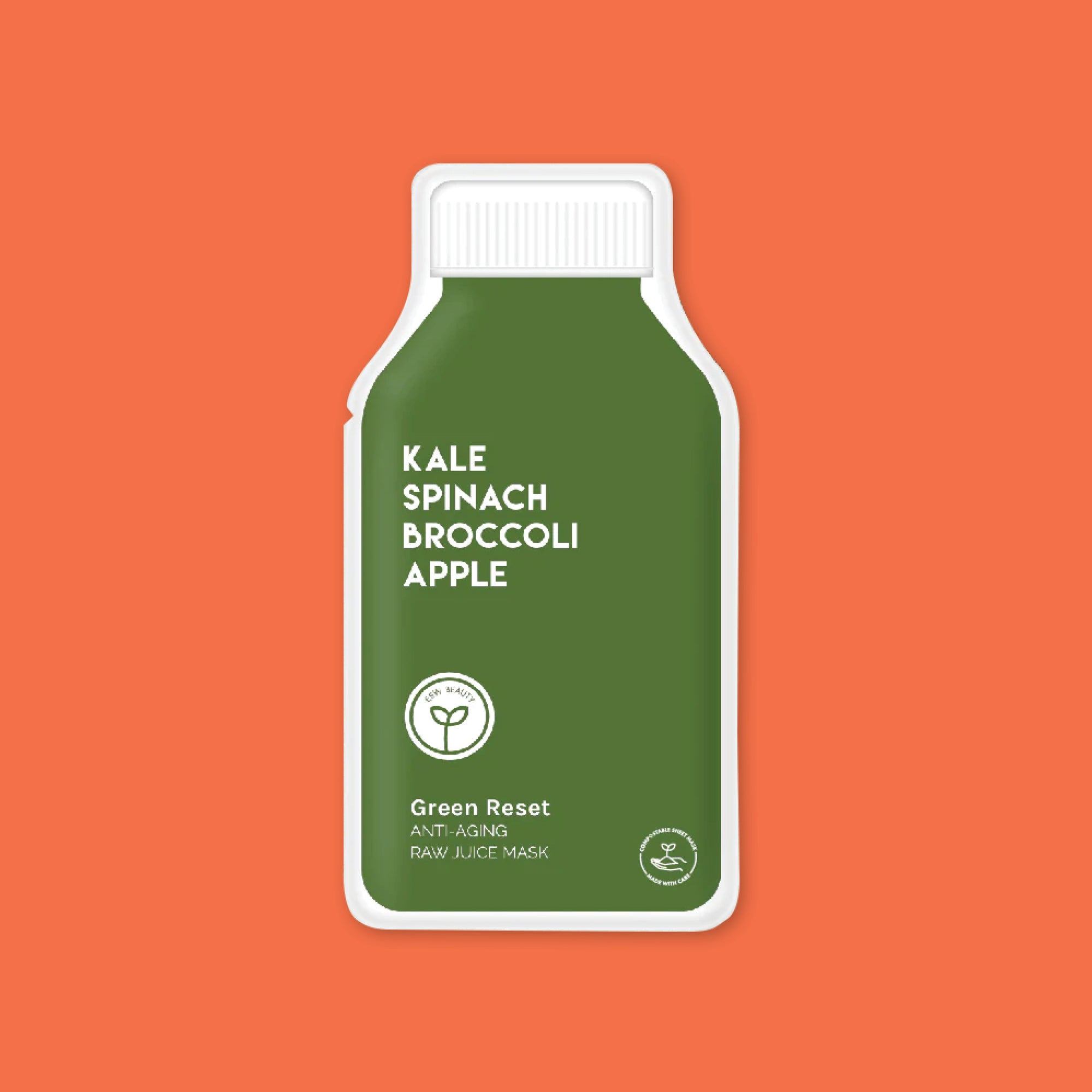 On an orange background sits an ESW Beauty single-use face mask in green packaging titled "Kale Spinach Broccoli Apple Green Reset Raw Juice Mask"