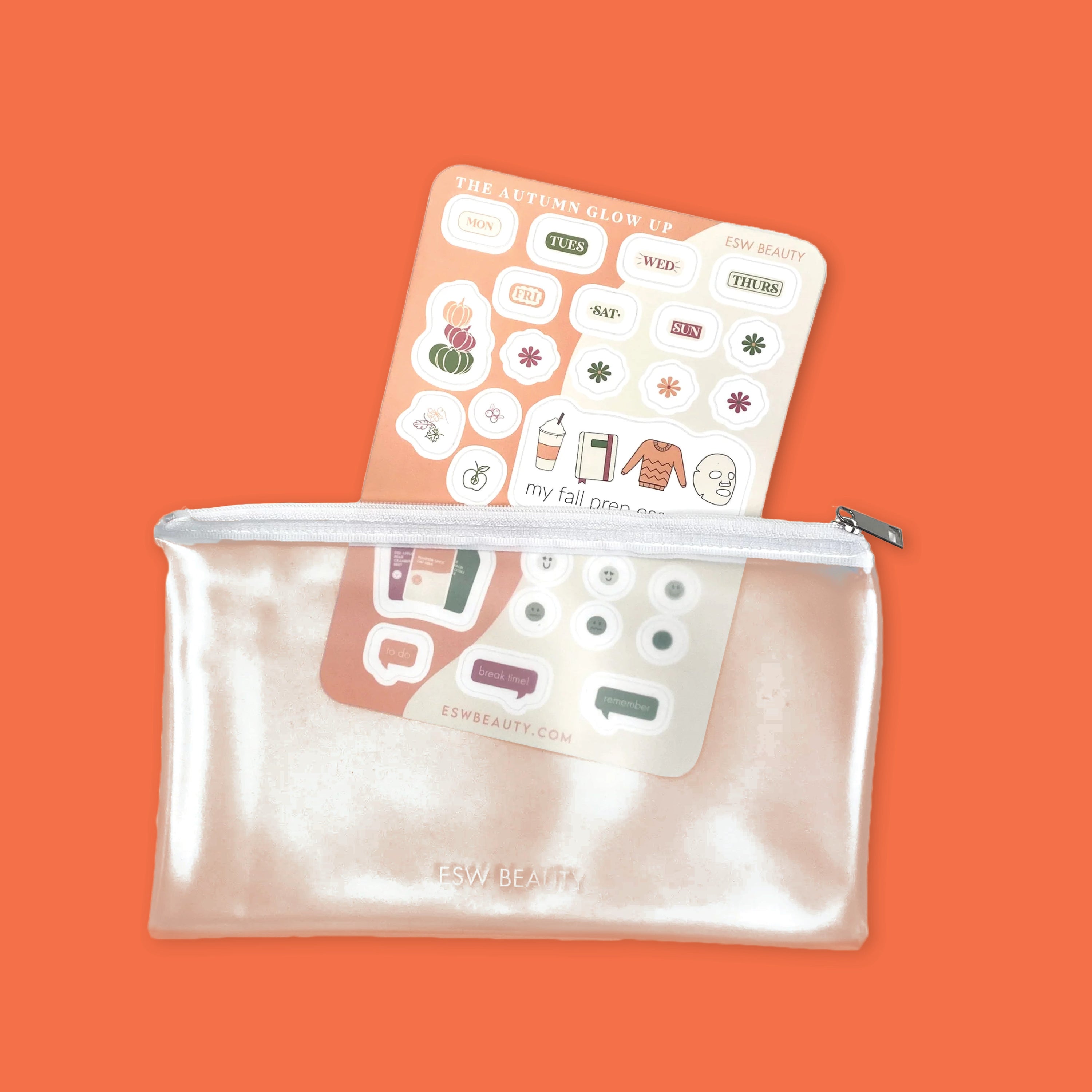 On an orange background sits a clear ESW reusable pouch and a sheet of fall skincare planner stickers.