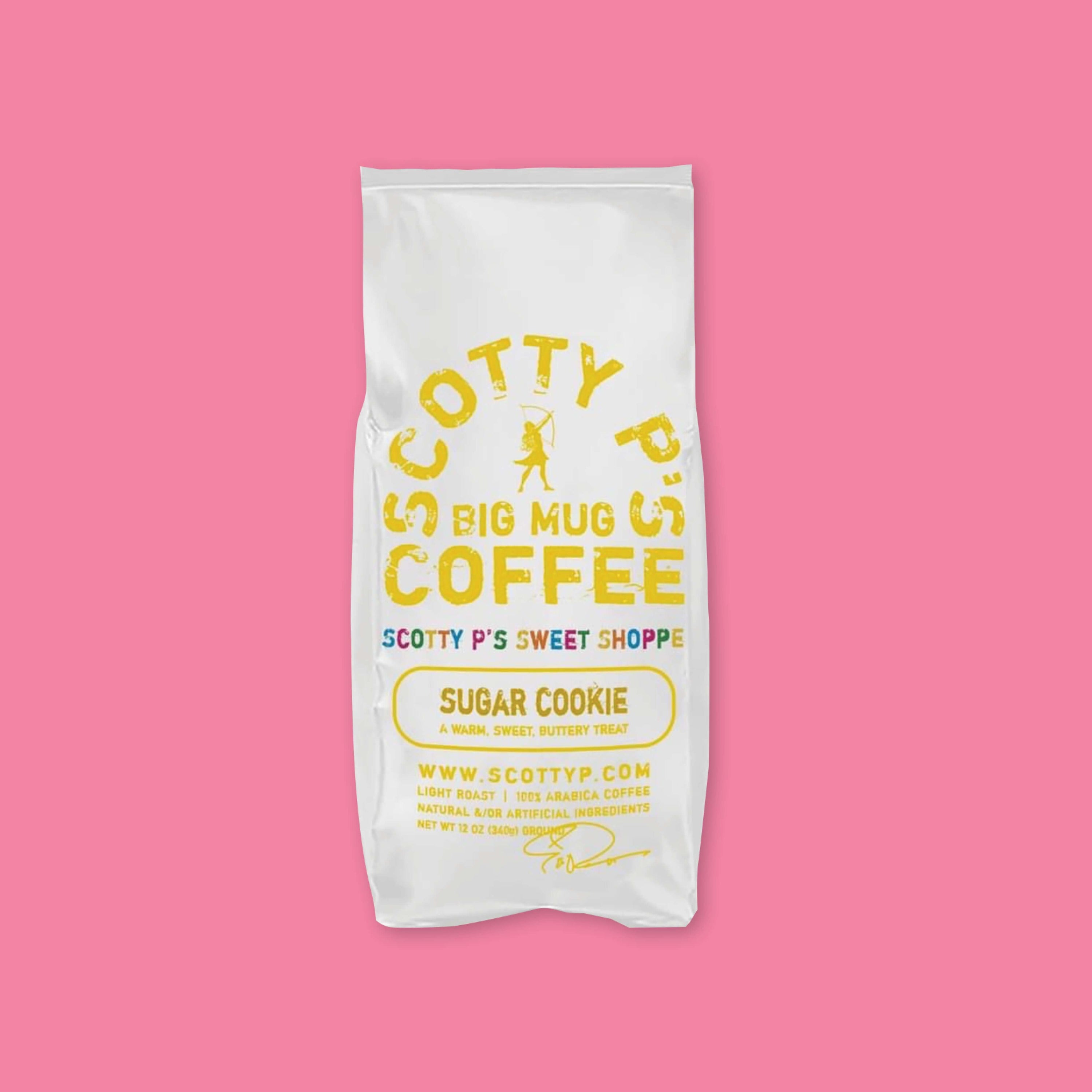 On a bubblegum pink background is a white bag of coffee. The coffee is Scotty P's Coffe Sugar Cookie Blend. It is a "warm, sweet, buttery treat." 12 oz (350g).