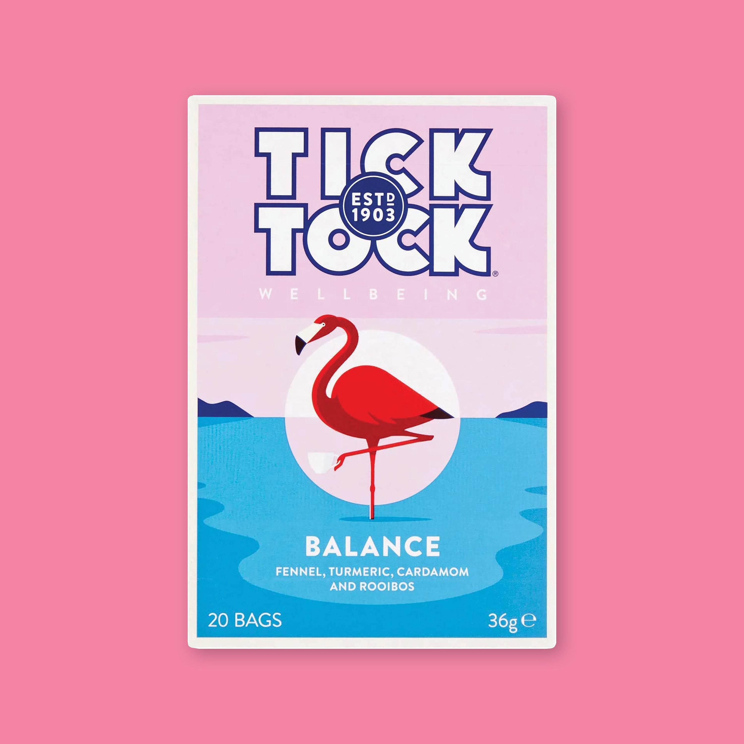 On a bubblegum pink background is a box of tea.The tea is Tick Tock Balance with blends of fennel, turmeric, cinnamon and rooibos. It is naturally caffeine free. It has an illustration of a flamingo standing on one leg. 