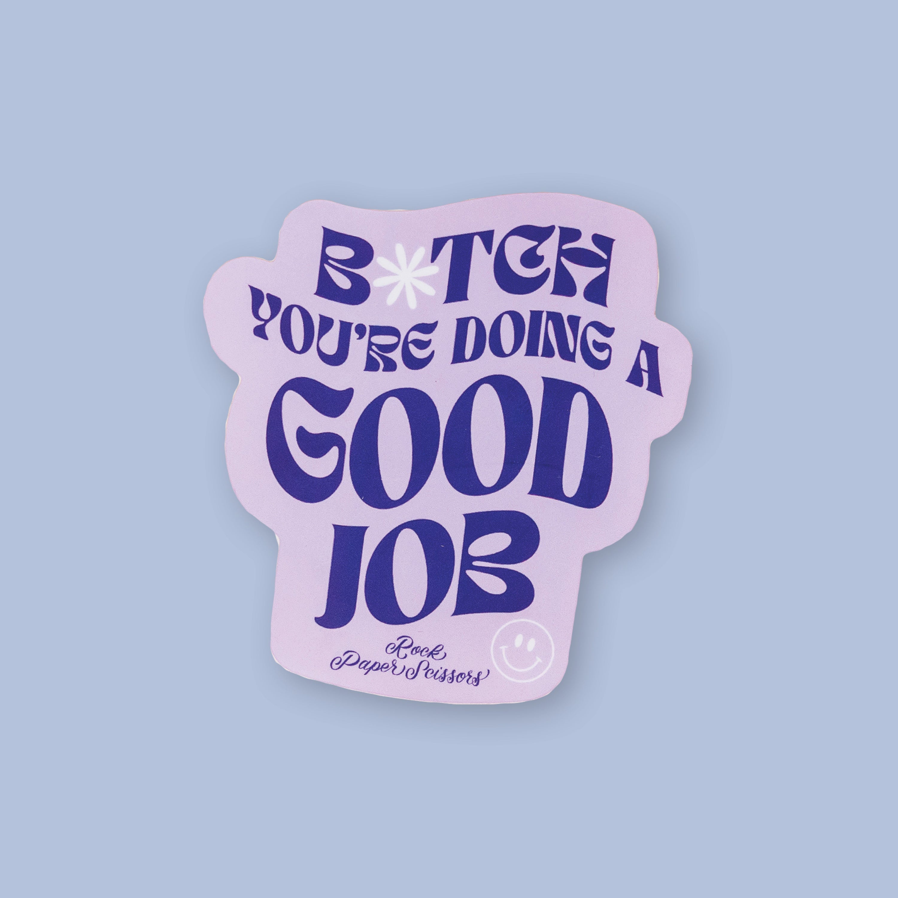 On a lavendar background sits an RPS Exclusive lavender sticker that says "B*tch you're doing a good job" in a purple, groovy font with "Rock Paper Scissors" below it in a handwritten font and a happy face in white,