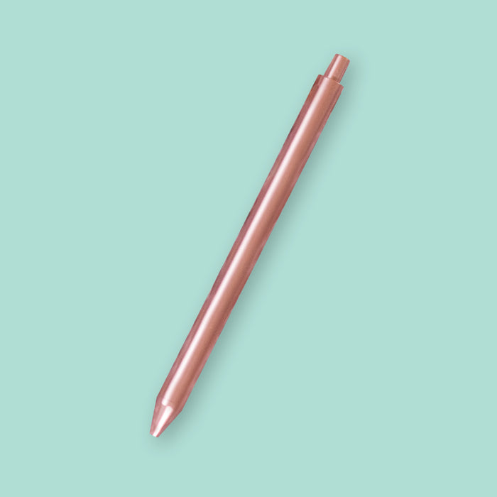 On a seafoam background sits a beautiful Jotter TOOT pen in rose gold.