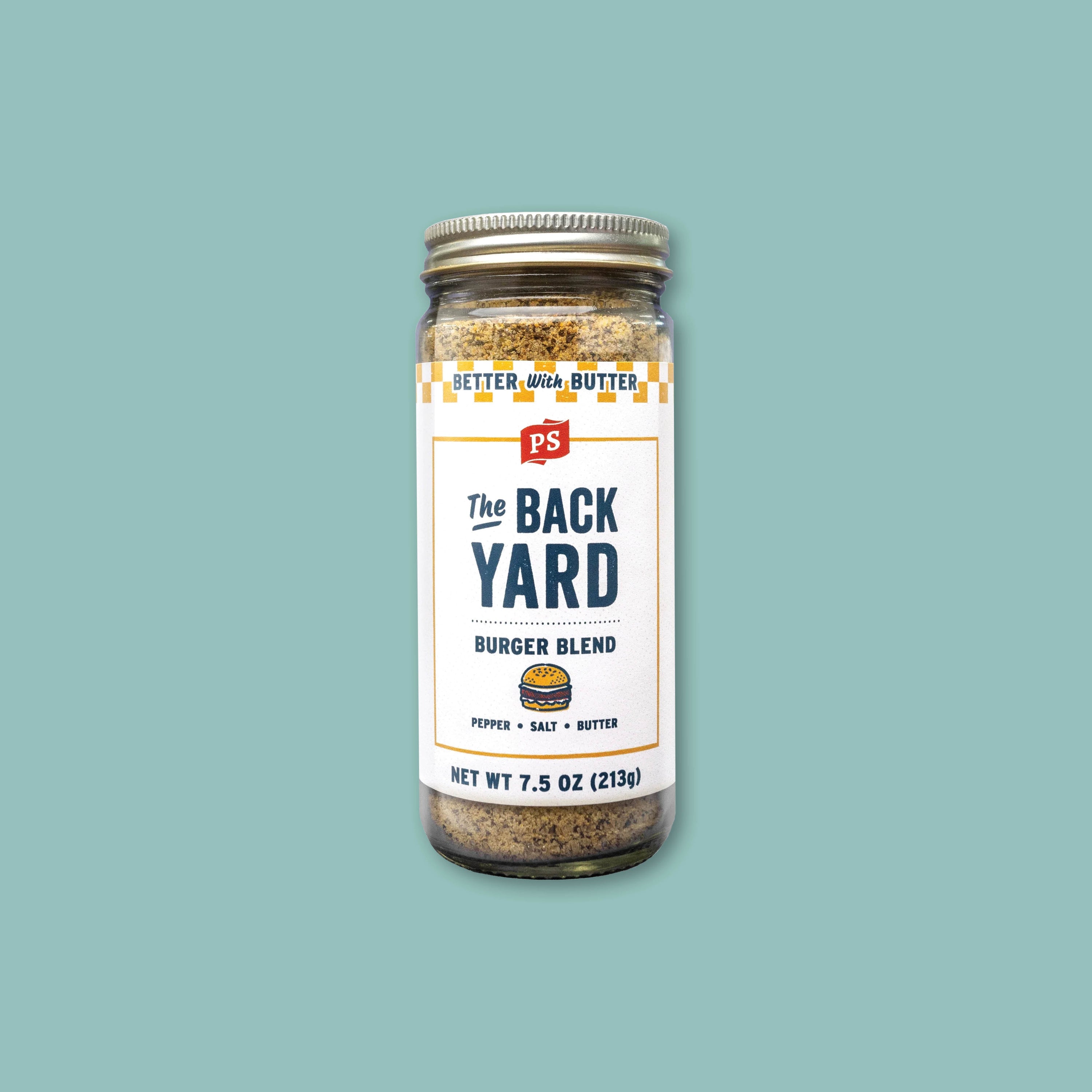 On a teal background sits a jar of The Back Yard Burger Blend seasoning with a white label.