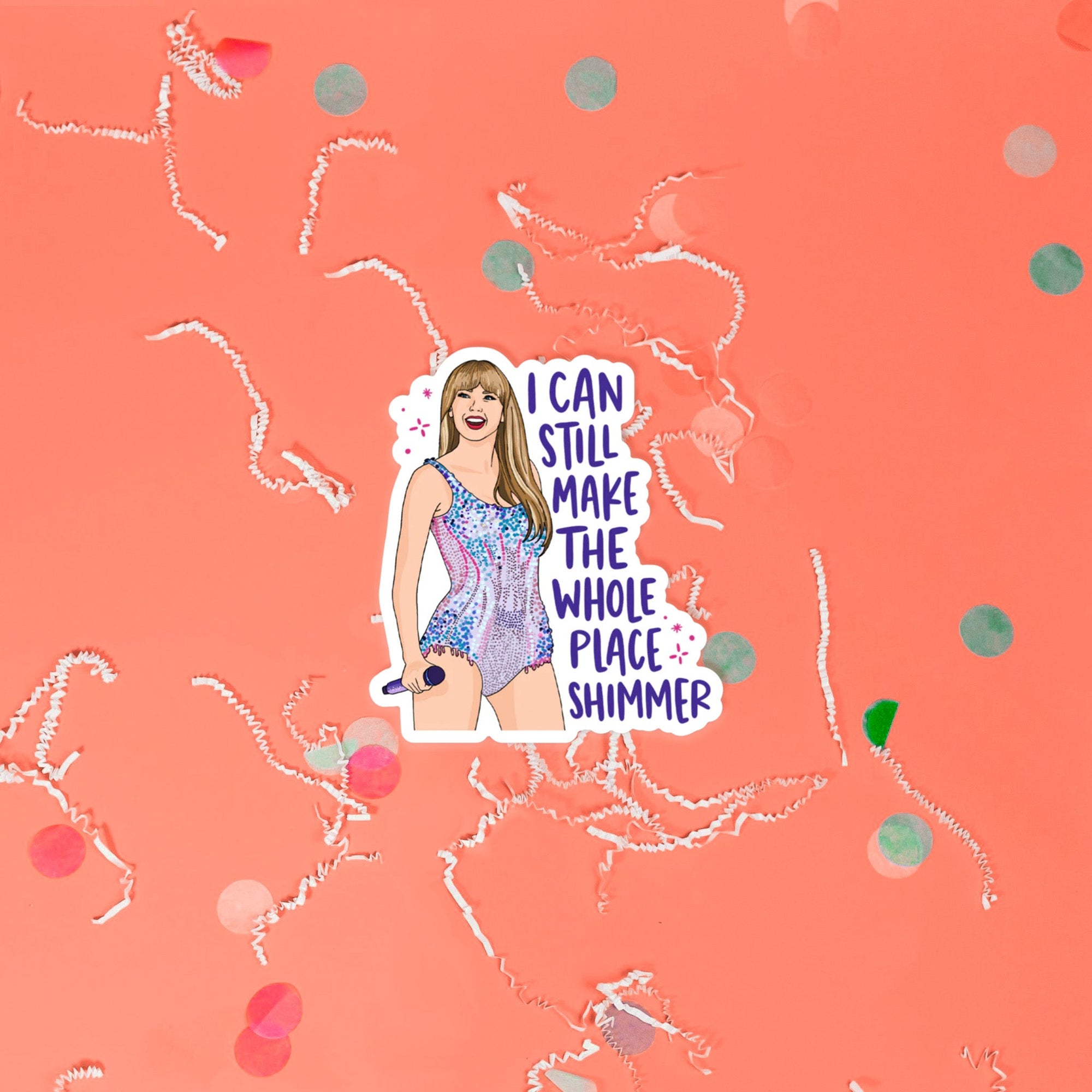 On a coral pink background sits a sticker with white crinkle and big, colorful confetti scattered around. This Taylor Swift inspired sticker is an illustration of Taylor Swift holding a microphone and wearing a shimmering dress. It says "I CAN STILL MAKE THE WHOLE PLACE SHIMMER" in purple lettering.