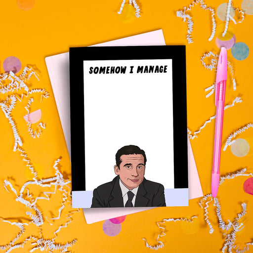 On a hot pink background sits a notepad and a pen. The Office inspired notepad has a black and lavender border with a white recangle on top. It says at the top "SOMEHOW I MANAGE" in black, all caps handwritten lettering. On the bottom is an illustration of Michael Scott wearing a black suit and black tie with white shirt.