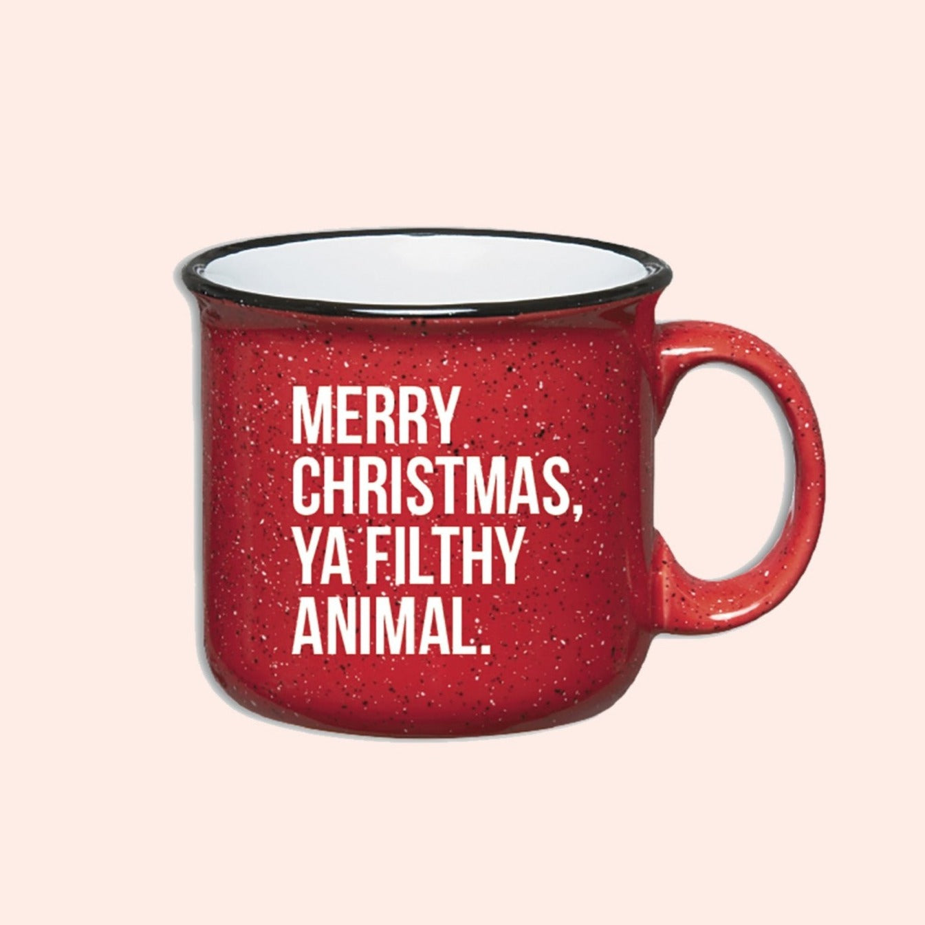 On a light pink background sits a campfire mug. This Home Alone inspired mug is red with black and white specks and it says in white lettering "MERRY CHRISTMAS, YA FILTHY ANIMAL."